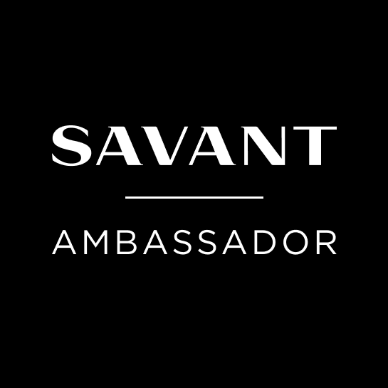 Transparent Savant Ambassador logo showing the word ‘Savant’ in bold white lettering and ‘Ambassador’ in light gray below it