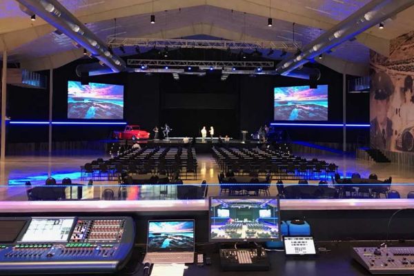 A vibrant image highlighting architectural details of a modern building, with clean lines, dramatic lighting, and textured surfaces that emphasize its design.